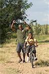 Father Helping Son Ride Bike