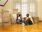 Couple at Home with Packed Boxes