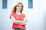 Smiling blond woman wearing red top