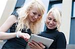 Two businesswomen with ipad