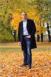 Man standing in autumnal landscape