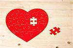 Heart shaped jigsaw puzzle with missing piece