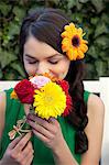 Woman smelling flowers