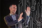 Businessman touching virtual circuit board symbols