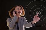 Young woman on cellphone and touching virtual circle