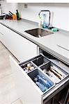 Open kitchen drawer with recycling