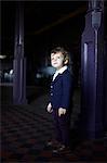 Little boy in room, wearing mod clothing