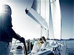 Couple on yacht with camera