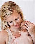 Mother holding newborn baby boy