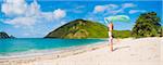 Woman celebrating freedom at Mawun Beach, a Tropical Paradise in South Lombok, Indonesia, Southeast Asia, Asia