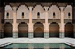A tiled interior courtyard and reflecting pool at the Ben Youssef Madrassa, Marrakech, Morocco, North Africa, Africa