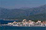 A view of St. Florent and distant mountains in the Nebbio region of nothern Corsica, France, Mediterranean, Europe