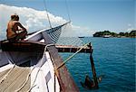 Tourist on a schooner cruising between the different beaches and islands around Parati, Rio de Janeiro State, Brazil, South America