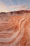 Orange and white sandstone layers with colorful clouds at sunrise, Valley Of Fire State Park, Nevada, United States of America, North America