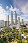 City centre including the KLCC park convention and shopping centre and the iconic 88 storey steel clad Petronas Towers, Kuala Lumpur, Malaysia, Southeast Asia, Asia