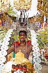 A Hindu devotee carrying portable shrine during Thaipusam in Singapore, Southeast Asia, Asia