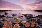 The Brisons on the horizon from the shores of Priests Cove, Cape Cornwall, Cornwall, England, United Kingdom, Europe