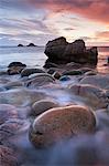 Porth Nanven cove and the Brisons Islands at sunset, Cornwall, England, United Kingdom, Europe