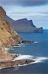 Towering cliffs near Gasadalur on the island of Vagar, Faroe Islands, Denmark, Europe