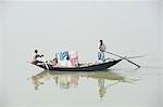 Village fishermen in wooden boat, River Hugli (River Hooghly), West Bengal, India, Asia