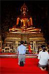 Prayer in Wat Suthat temple, Bangkok, Thailand, Southeast Asia, Asia