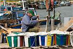 Fisherman mending nets, Potamos Tou Liopetri, Cyprus, Europe