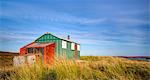 Colourful summer hut (sheiling) on the wind swept moors of the Isle of Lewis, Outer Hebrides, Scotland, United Kingdom, Europe