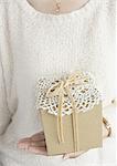 Hands holding a gift box