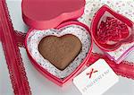 Heart-shaped chocolate and a message card