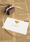 Chocolates tied with ribbon and a message card