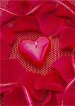 Petals and a heart-shaped candle