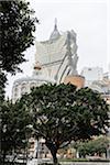 Trees in front of Grand Lisboa Hotel and Casino, Macau, China