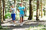Young couple running in park