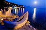 White Boat on the Beach and Transparent Mediterranean Sea in the Night, Croatia