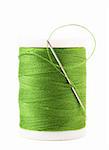 Single spool with green thread and needle