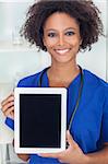 An African American female woman medical doctor with a tablet computer in hospital