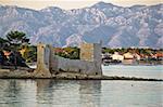 Island of Vir fortress ruins with Velebit mountain in background, Dalmatia, Croatia