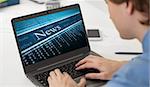 businessman reading business news on his laptop