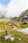 Italy, Monviso mountain. A path sign close to the top of one of the most scenic mountain of Alps.