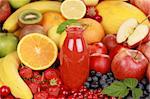 Freshly squeezed juice from red fruits in a bottle