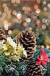 Christmas Decoration Garland with Poinsettia Pine Cones and Colorful Blurred Bokeh Lights Background