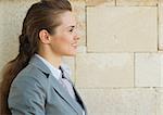 Profile portrait of happy business woman looking on copy space