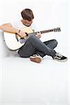 Young Man Playing Acoustic Guitar