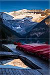 Red Canoes on Dock at Dawn, Lake Louise, Banff National Park, Alberta, Canada