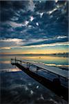 Dock on Still Lake with Dark Clouds Overhead, King Bay, Point Au Fer, Champlain, New York State, USA