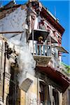 Construction Worker Standing in Elevated Word Platform During Building Demolition, Havana, Cuba