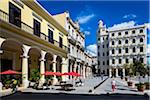 Restaurant Patio with Red Umbrellas Facing Plaza Vieja, Havana, Cuba