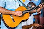 Close-Up of Man Playing Guitar in Band, Taberna de La Muralla, Plaza Vieja, Havana, Cuba