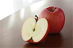 Red apples on a wooden table