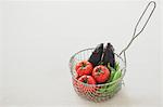 Vegetables in a metal basket on a table